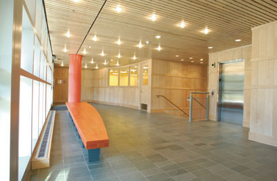 The side lobby of the Center for Drama and Film shows the beautifully tiled floor and maple-panelled walls