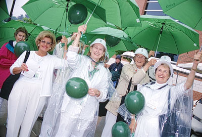 Members of the class of 1953 look excited as they parade towards Walker