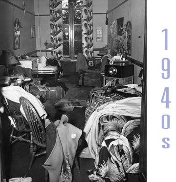 A Vassar dorm room from the 1940s, messy, with various items scattered about