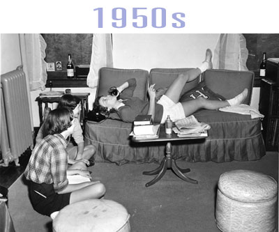 A well decorated Vassar dorm room from the 1960s. A large feather-type object sits on the bed