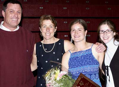 From left to right: Rugby coach Tony Brown, field hockey coach Judy Finerghty, Maureen Kenealy '04, and Kenealy's sister