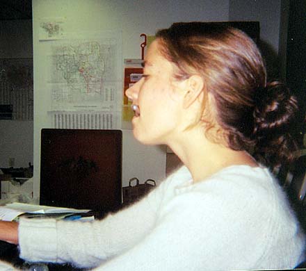 At work in the Move On office in Ann Arbor.   There are precinct maps of the city and surrounding areas in the background.