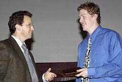 Volleyballï¿½s Steve Gilhool '05 (right) accepts the inaugural Athletic and Fitness Alumnae/i of Vassar College (AFAVC) Award from Matt Soper ï¿½91