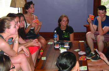 Students play card games at Blegen House