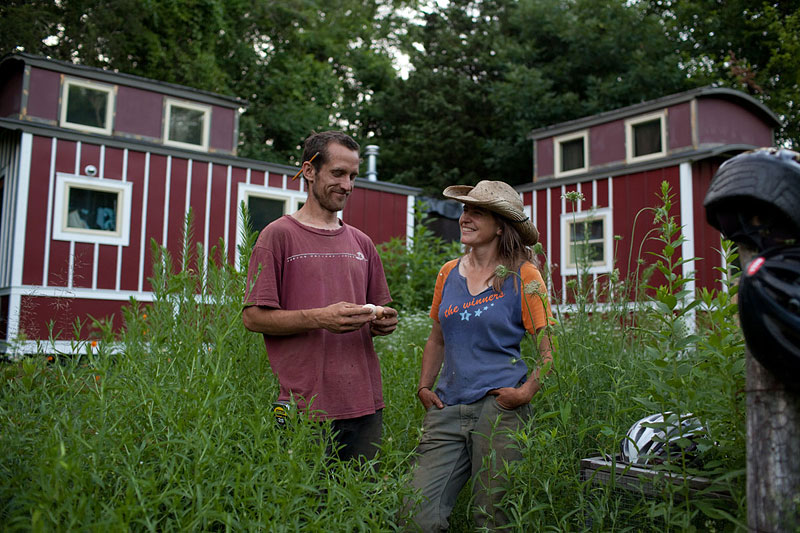 Miriam Latzer ’97 and boyfriend Justin in front of their caboose-shaped residence at Loose Caboose Farm in Clermont, New York. “The caboose is loose because it has no breaks,” Latzer says of her growing business.