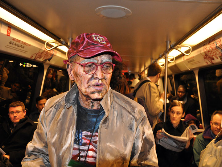 Sometimes, Meade places her models into real-life contexts, such as a subway car. “Transit.”