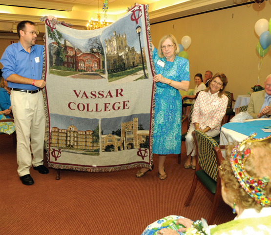 Stern receives a Vassar blanket, a present from the college.