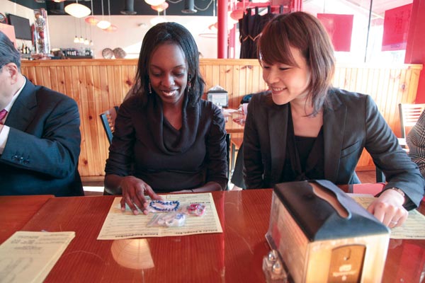 In Poughkeepsie, Contessa Mwedzi ’13, left, reunites with Yuka Yamada, who manages Ashinaga’s Rainbow House in Uganda. Mwedzi worked there last summer. 