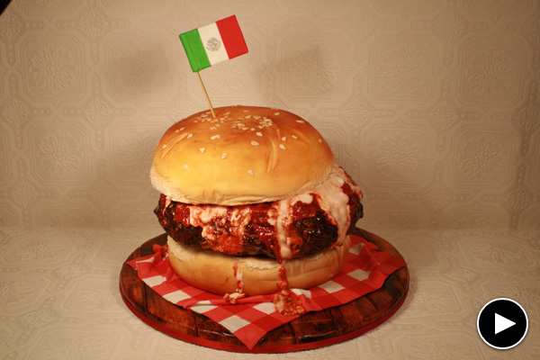 Yes, this mouthwatering pizza burger actually is a cake. View the slideshow to find out how Strauss created it.