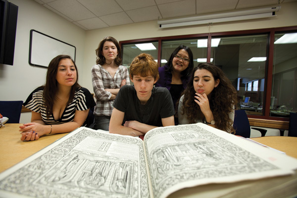 Dorothy Kim, top right, reviews a Chaucer manuscript in class.