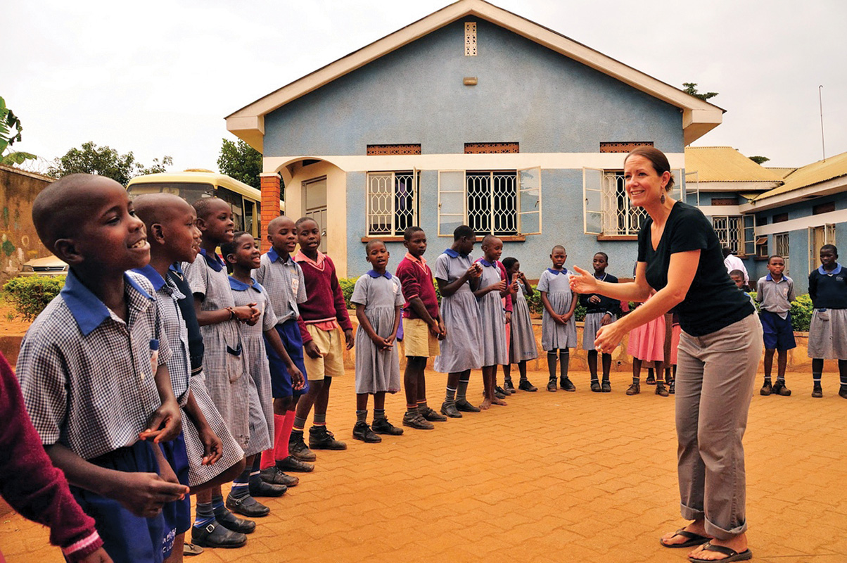 Christine Howlett spent time in Uganda in 2013, teaching songs to children that they would later perform in Japan.