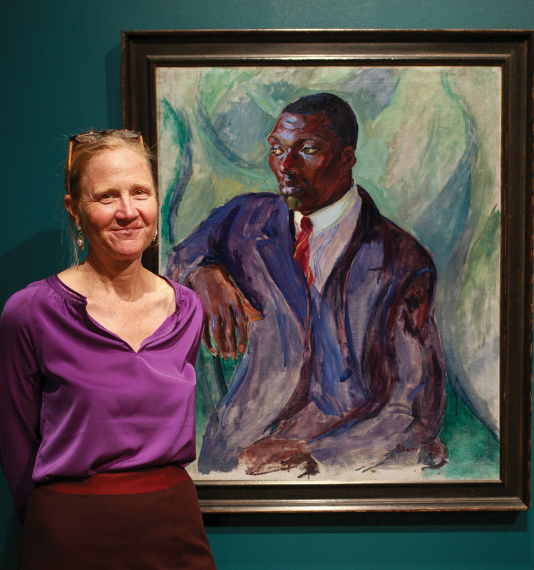 Curator Barbara Paca with Rose's Suited Man